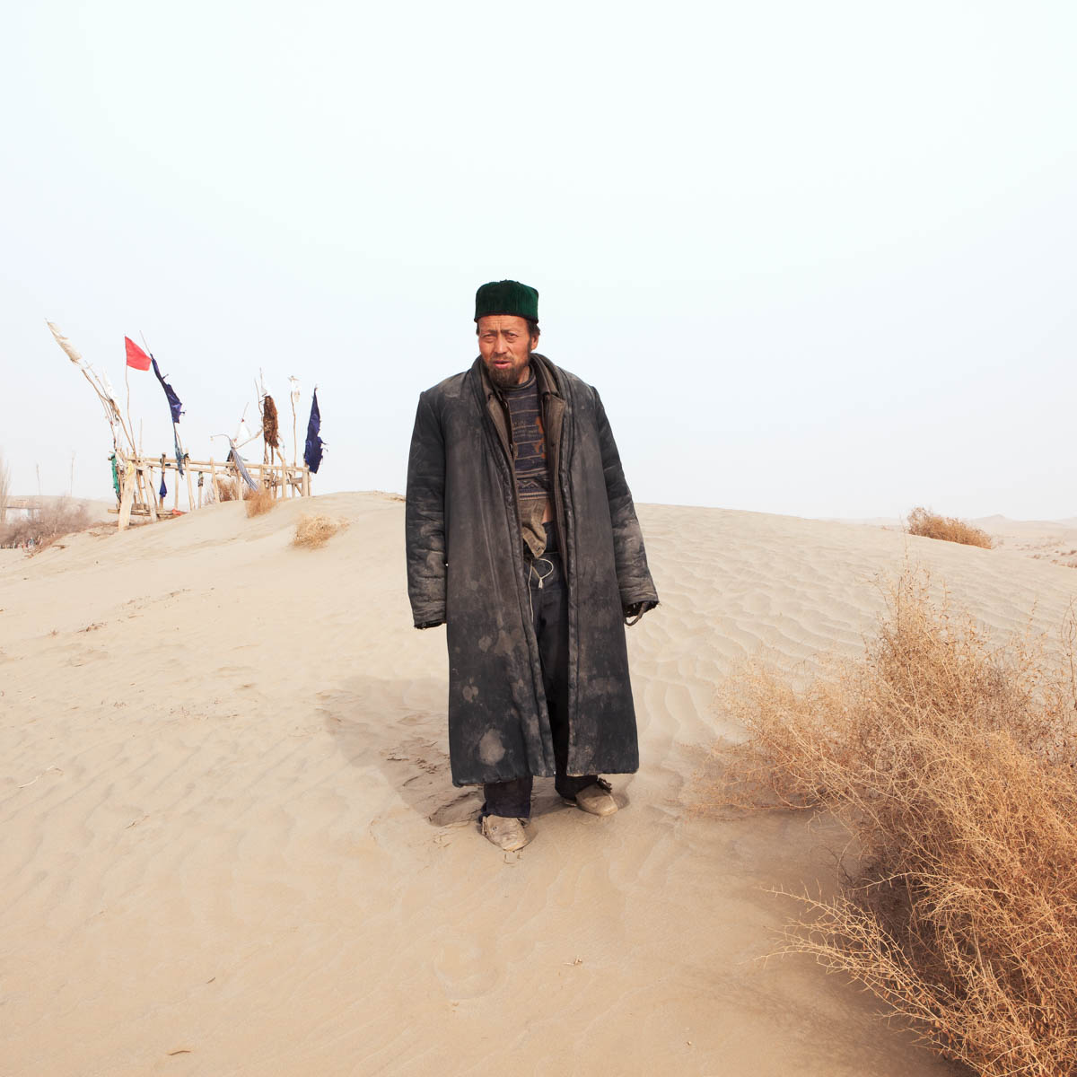 Guardian of the Imam Asim Tomb. The Imam is said to be one of the first Islamic missionaries in the region. Hotan, Xinjiang, China 2012.