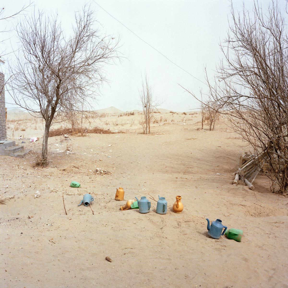 Plastic ablution pots - Plastic ablution pots at the Imam Asim Tomb. Thes pots are used by people to wash their feet and hands before attending to any prayer in the mosque.  Hotan, Xinjiang, China 2012. 