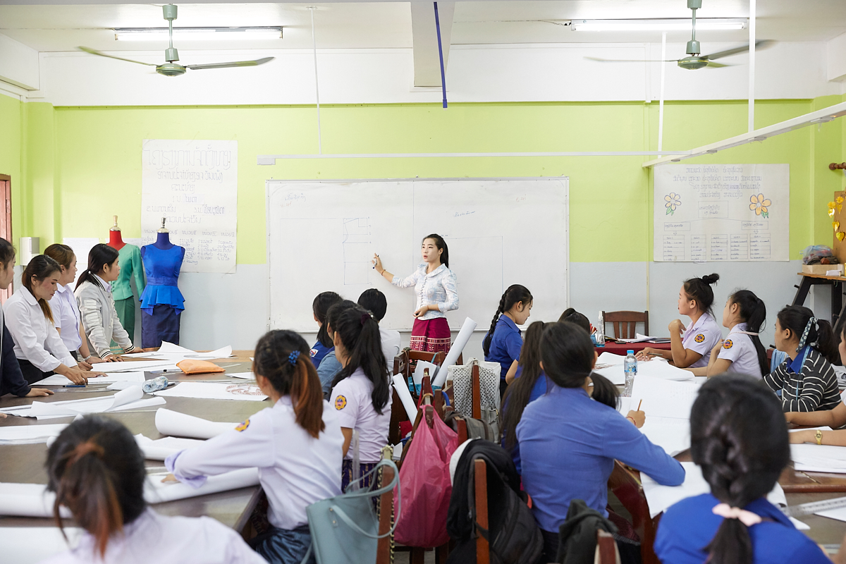 Class at the Vientiane Capital Skill Development Center. Young Lao women are here given a chance to learn the basic skills of industrial sewing. Vientiane, Laos, November 2018.