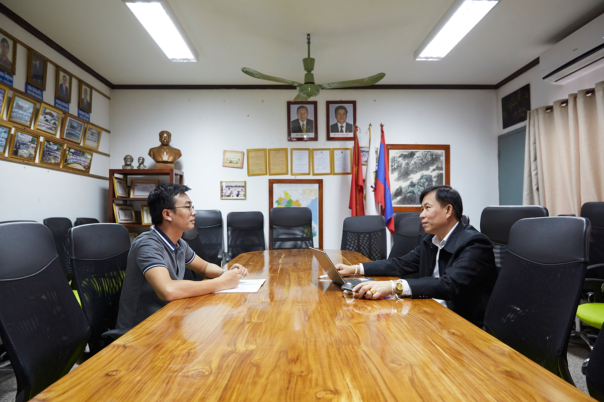 At the right, Prof. Dr. Bounseng Khammounty, National University of Laos, at a meeting with Dr. Keonakhone, responsible for the food processing study. Prof. Bounseng is the leader of the study in Laos. Vientiane, Laos, November 2018.